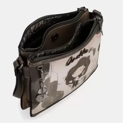 Bolsa castanha com design ilustrativo feminino, forro preto e fechos metálicos