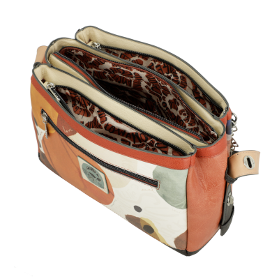 Mala de senhora colorida com vários compartimentos abertos e padrão floral interior