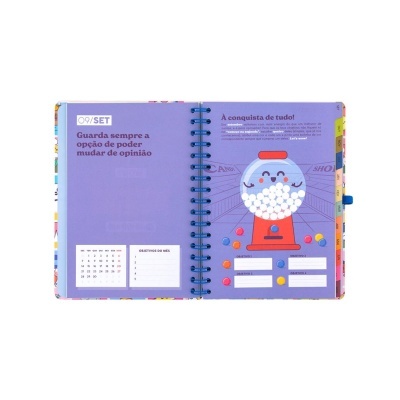 Agenda aberta com design colorido e ilustração de dispensador de bolas