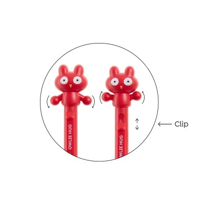 Objeto de plástico vermelho com cabeça de animal e braços móveis e clip.