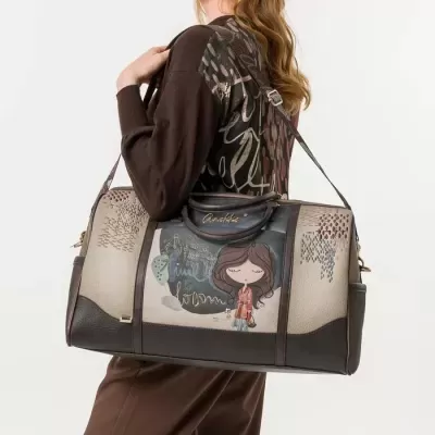 Mala de viagem castanha e bege com desenho de personagem feminina e alça ajustável