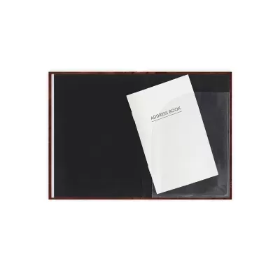 Caderno aberto com página preta e folheto branco com texto ADDRESS BOOK