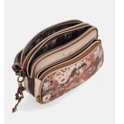 Bolsa pequena com padrão floral em tons castanho, bege e rosa e fechos de correr metálicos