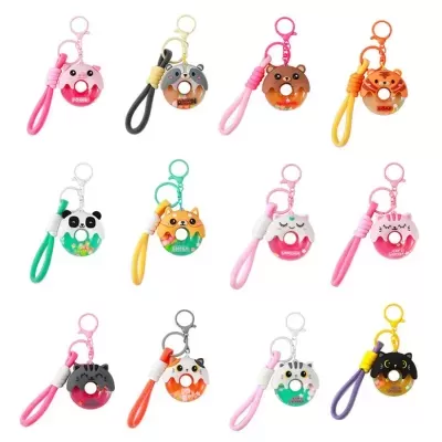 Conjunto de porta-chaves em forma de donuts com rostos de animais e pulseiras coloridas