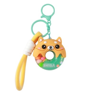 Chaveiro em forma de donut com cabeça de cão e cordão amarelo