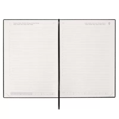 Agenda aberta com páginas pautadas e texto impresso no topo