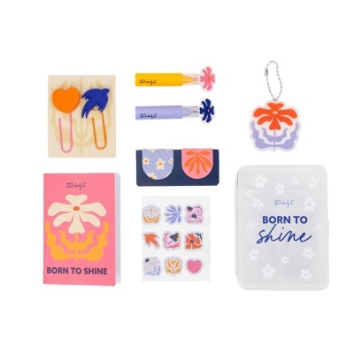 Conjunto de artigos de papelaria coloridos com tema floral e texto BORN TO SHINE