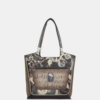 Saco de mão castanho e bege com padrão floral e bolso frontal transparente com texto