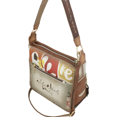 Mala de tiracolo castanho com padrão colorido e texto 'timeless beauty'