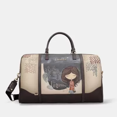 Mala de viagem bege e castanha com desenho de personagem e texto Anekke
