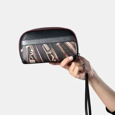 Carteira preta e castanha com padrão e alça de pulso