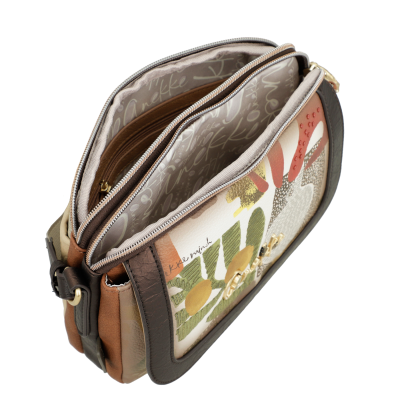 Mala de senhora em pele e tecido com padrão gráfico abstrato e fechos de correr