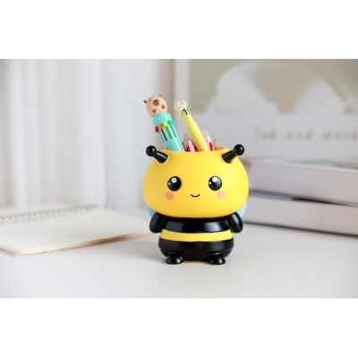 Suporte de secretária em forma de abelha amarela e preta com canetas