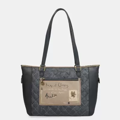 Mala de senhora cinzenta acolchoada com bolso frontal bege e alças pretas.