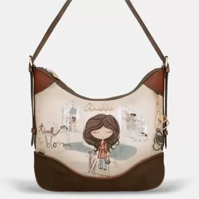 Mala de ombro castanha e creme com ilustração de menina e texto Anekke