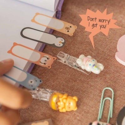 Clips transparentes com decorações de animais e marcadores de páginas com animais
