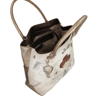 Mala de senhora bege e castanha com ilustração e texto, vista aberta mostrando interior forrado.