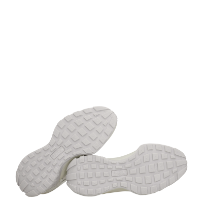 Solados brancos de sapatilhas com relevo quadrado e selo da marca Anekke