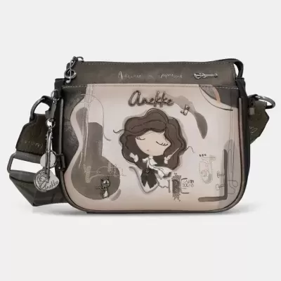Mala de ombro bege e castanha com ilustração de mulher cartoon e gato