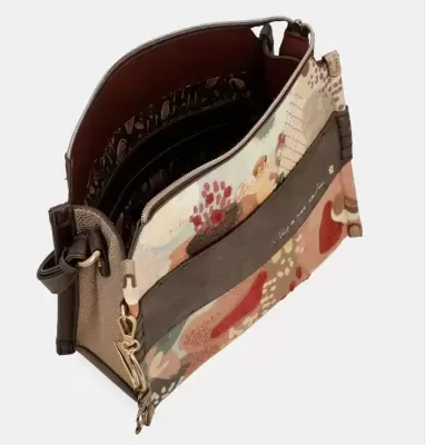 Mala de senhora com padrão floral colorido, fecho com zíper e interior vermelho