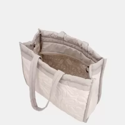Mala tote acolchoada bege e creme aberta a mostrar interior com bolso