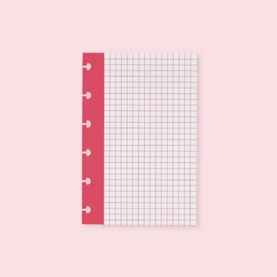 Bloco de papel quadriculado com margem vermelha