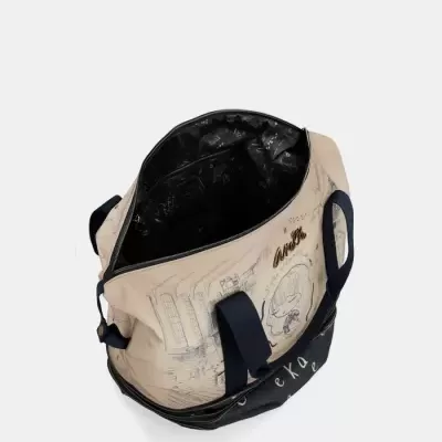 Mala de mão bege e preta com alças azuis e estampas desenhadas com interior forrado preto