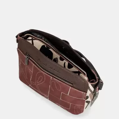 Mala de ombro castanha e bege com padrões abstractos