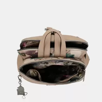 Mala de mão bege com três compartimentos abertos e interior estampado colorido