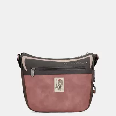 Mala de ombro cor de rosa e castanha com bolso frontal e etiqueta decorativa