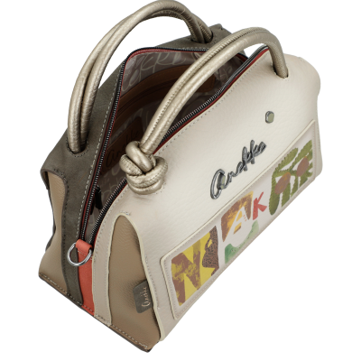 Mala de mão em couro bege com alças douradas e padrão colorido