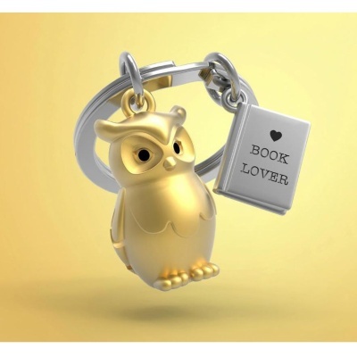Chaveiro com coruja dourada e livro prateado com texto BOOK LOVER