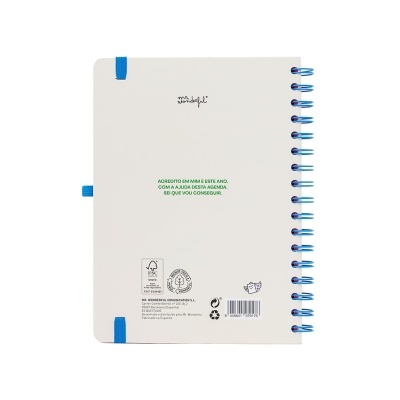 agenda branca com espiral azul e texto verde no centro