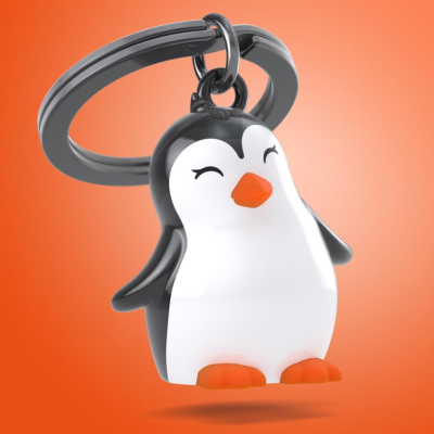 Chaveiro de pinguim sorridente em material plástico