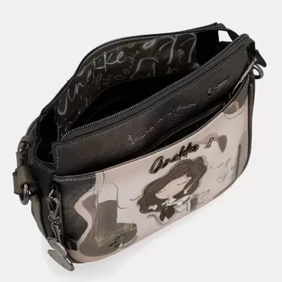 Bolsa feminina preta e bege com ilustração e fecho de correr aberta