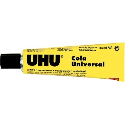 Tubo amarelo de cola UHU Universal com tampa preta e texto em várias línguas.