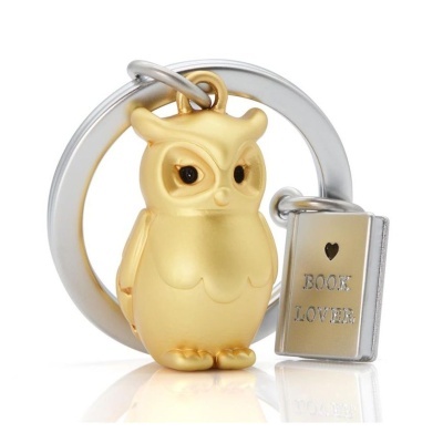 Porta-chaves com coruja dourada e livro prateado com texto BOOK LOVER