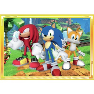 Imagem colorida de personagens Sonic, Knuckles e Tails em cenário de jogo
