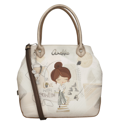 Mala de mão bege com alças douradas e ilustração de menina com texto