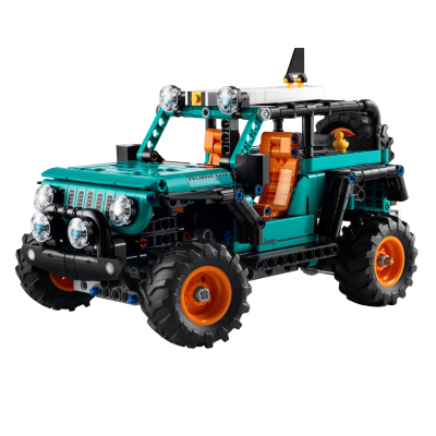 Modelo de brinquedo Jeep Rubicon com plástico verde turquesa, preto e laranja, com bancos quadriculados e faróis redondos.