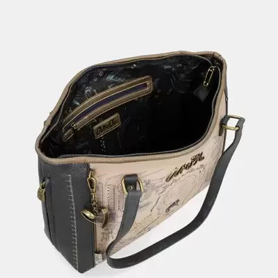 Mala de ombro feminina bege e preto aberta mostrando interior