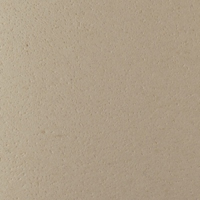 Superfície bege clara com textura granulada