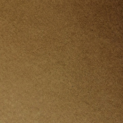 Superfície castanha de papel ou cartão com textura rugosa