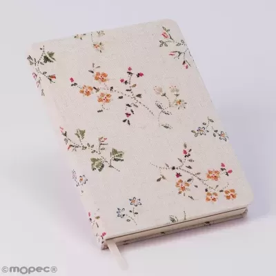 Caderno com capa texturizada em tecido creme com padrão floral colorido