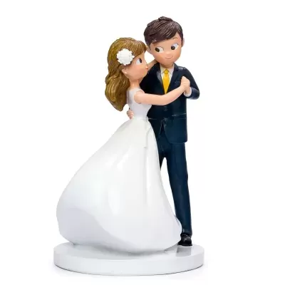 Figura de casal de noivos a dançar com vestido branco e fato preto