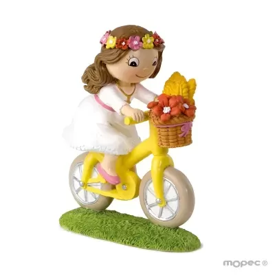 Figura decorativa de menina em bicicleta amarela com cesto de flores.