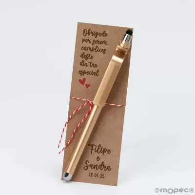 Caneta dourada com cartão de agradecimento em castanho