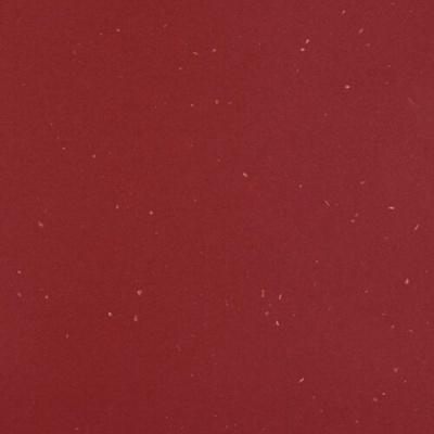Superfície vermelha com partículas claras dispersas