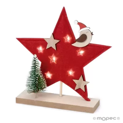 Estrela decorativa vermelha com ornamentos de Natal e luzes numa base de madeira clara.