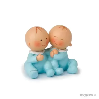 Figuras decorativas de dois bebés sorridentes em pijamas azuis